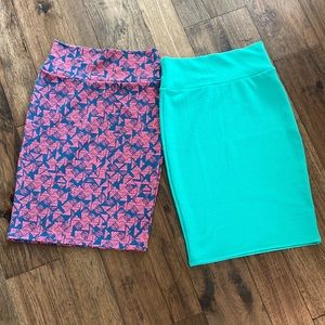 Two Lularoe pencil skirts, size XS. One green and one blue with pink triangle